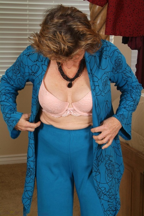 Gorgeous mature lady Judy exposes her hairy crotch while changing