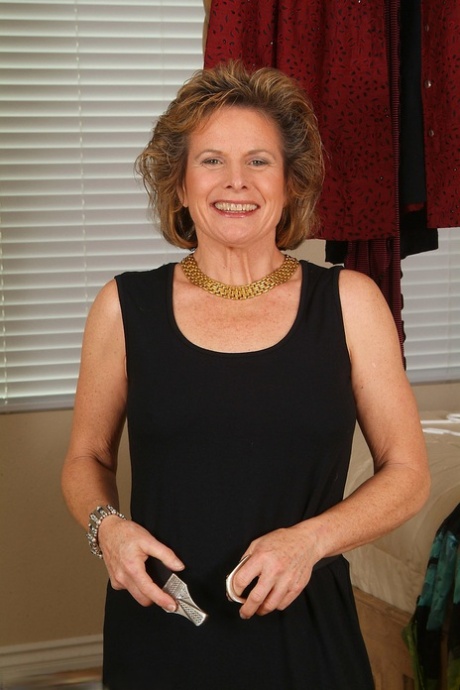 Gorgeous mature lady Judy exposes her hairy crotch while changing