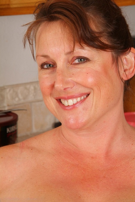 Chubby mature housewife Marishka strips naked & touches herself in the kitchen