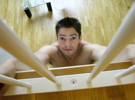 Kinky babes strip a guy and play with his dong while he hangs from the stairs
