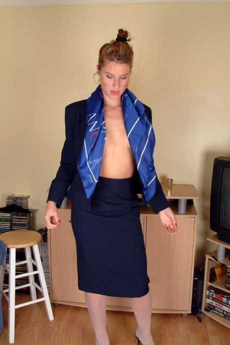 Sexy stewardess Angelina loses her uniform and spreads her hairy vagina