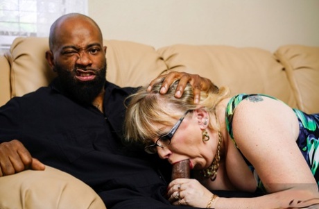 Chubby mature woman with big saggy tits gets screwed by her black lover