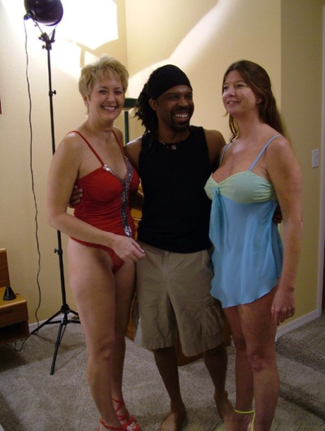 Horny matures with incredible juggs share a long haired guy's black cock