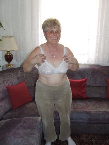 Chubby blonde granny Petra doffs her clothes and flaunts her natural tits