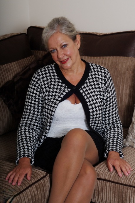 Blonde mature April reveals her big juggs & masturbates with a toy in lingerie