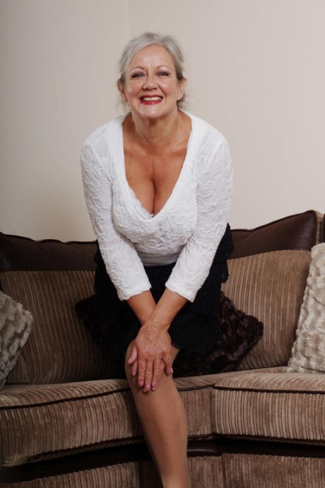 Blonde mature April reveals her big juggs & masturbates with a toy in lingerie
