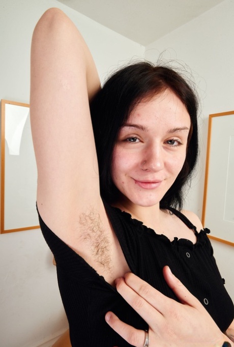 Sensual girlfriend Rosalyn Sphinx exposes her hairy pussy and small titties