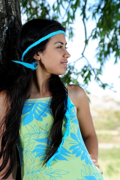Exotic Latina Ambar strips under the big tree and touches her hairy twat
