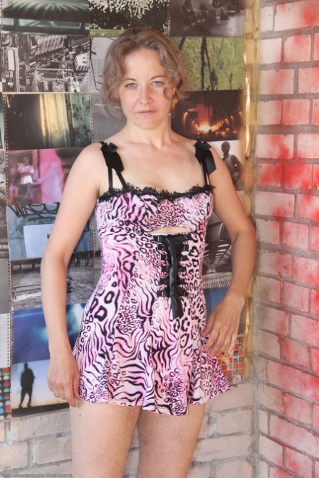 Tall amateur MILF Olga teasing with her hairy legs and pussy in a solo