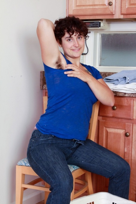 Filthy housewife Valerie teases with her hairy crotch and armpits in a kitchen