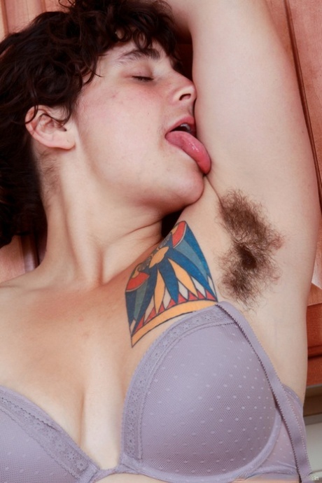 Filthy housewife Valerie teases with her hairy crotch and armpits in a kitchen