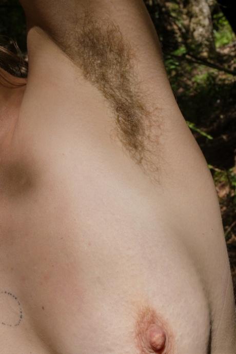 Babe with hairy armpits Cookie shows her chubby body and bush in the woods