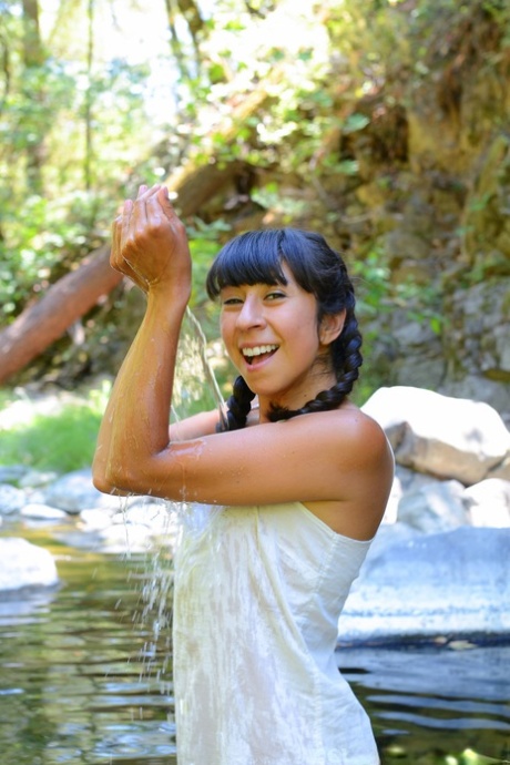 Latina sweetheart Vivi Marie strips in the local river & washes her hairy body