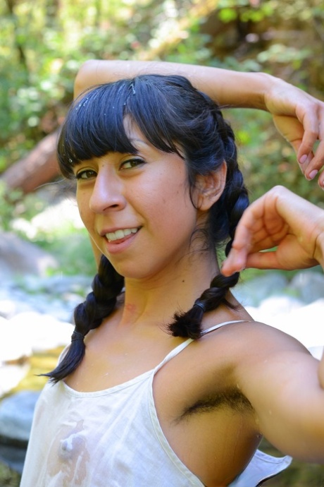 Latina sweetheart Vivi Marie strips in the local river & washes her hairy body
