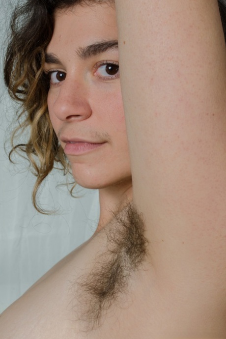 Amateur babe in white undies Serai flaunts her hairy pussy in a solo