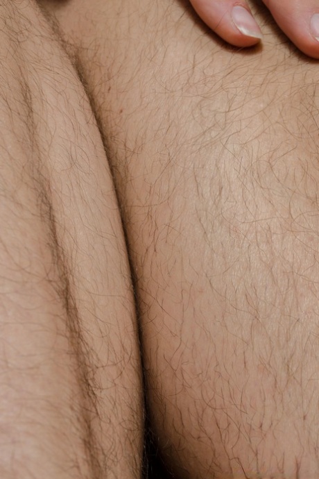 Amateur babe in white undies Serai flaunts her hairy pussy in a solo