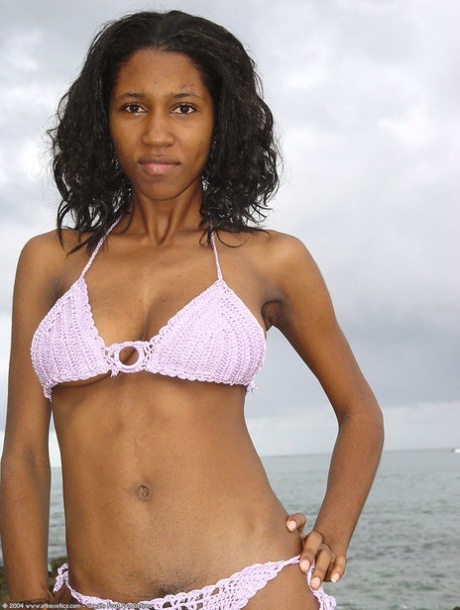 Exotic amateur ebony Satya washes her big tits, ass & hairy pussy in the sea