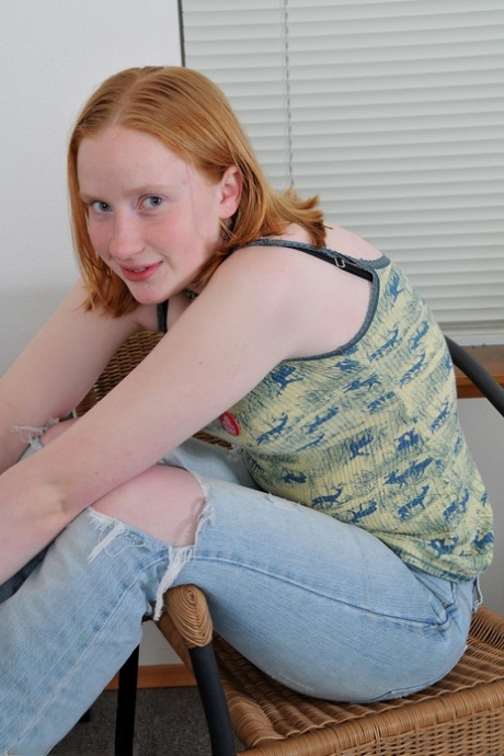 Amateur teen Sandy strips and fingers her furry muff while sitting on a rug