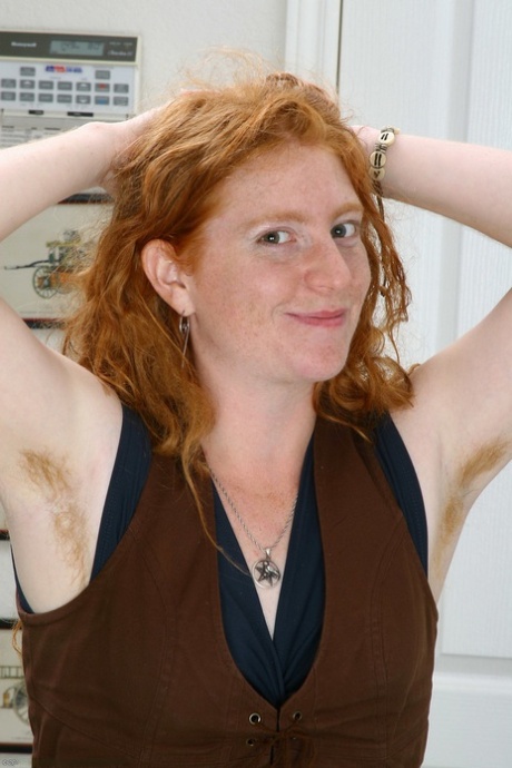 Redheaded amateur Morgan massages her natural tits & spreads her hairy pussy