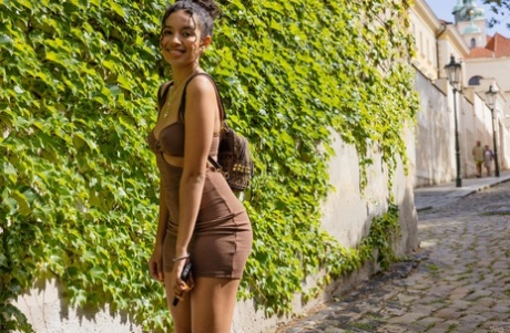 Adorable ebony Valery Ponce flashes her nice titties and amazing ass outdoors