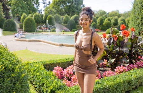 Adorable ebony Valery Ponce flashes her nice titties and amazing ass outdoors