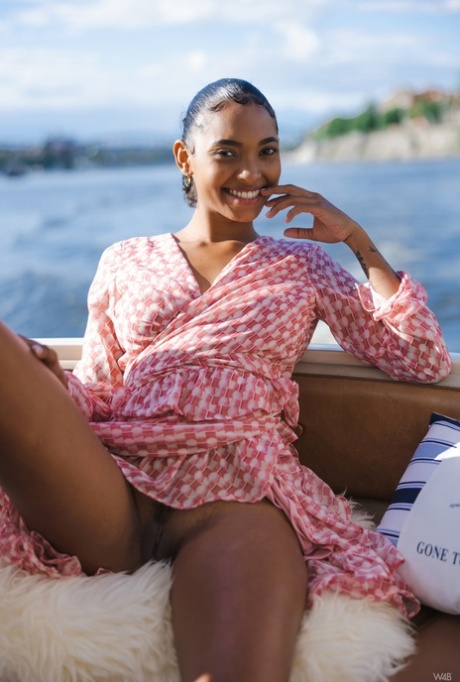 Alluring babe Barbie shows her beautiful big tits while enjoying a boat ride