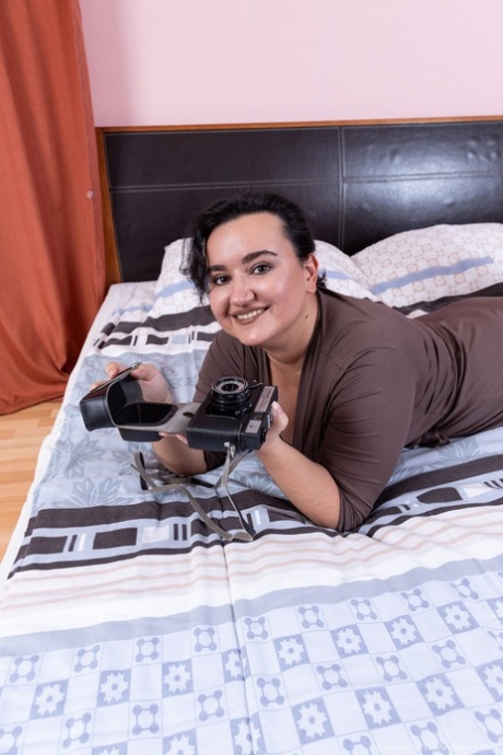 Chubby American Ramira unveils her monster tits & ass & her hairy pussy