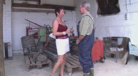 German GILF with a big ass Erica sits on her neighbor's dick in his workshop