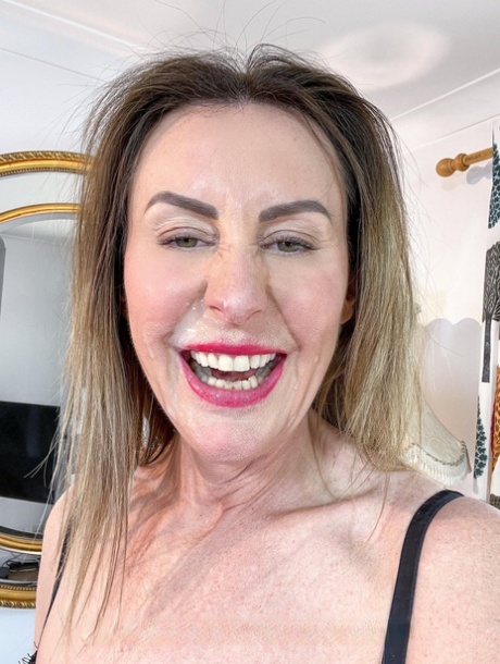 Stunning mature stewardess Lara Latex strips to her stockings & heels