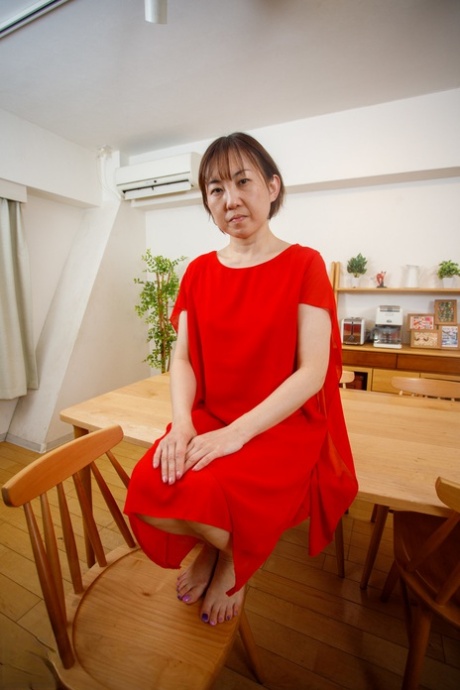 Japanese mom Yuki Kozakura posing in her red dress and panties in a solo