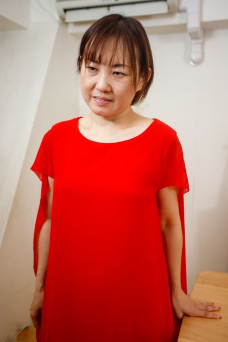 Japanese mom Yuki Kozakura posing in her red dress and panties in a solo