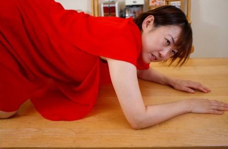 Japanese mom Yuki Kozakura posing in her red dress and panties in a solo