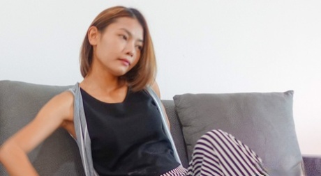 Amateur Thai babe Barbie displays her skinny body and touches her cunt