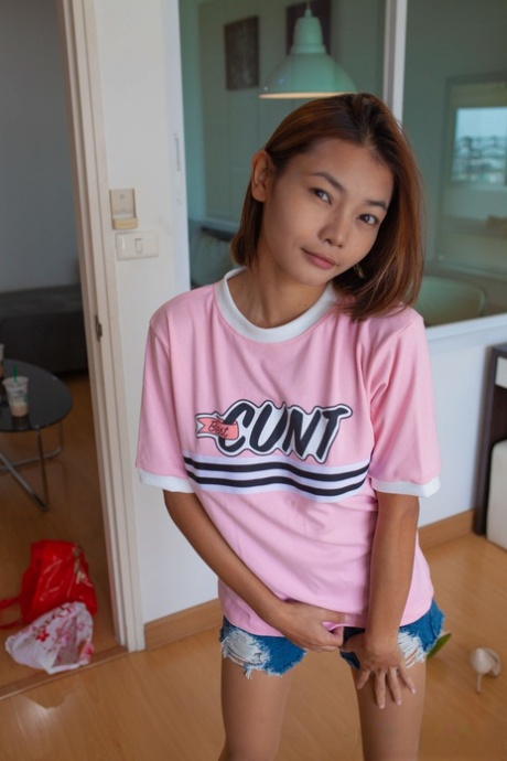 Amateur Thai babe Barbie displays her skinny body and touches her cunt
