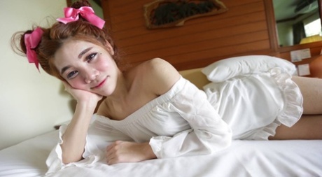 Shy Asian ladyboy Ami strips her white dress, shows her tiny dick & gives a BJ
