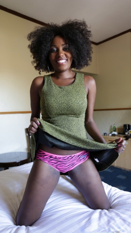 Ebony amateur with crazy hair Fifi shows her big tits before hot POV sex