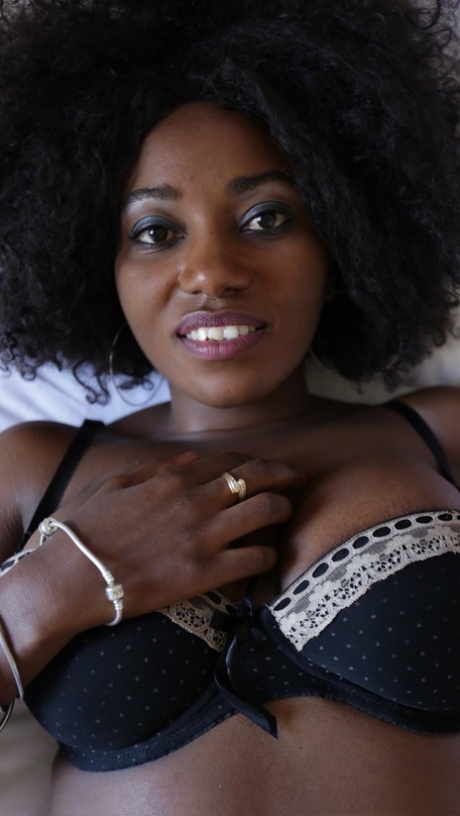 Ebony amateur with crazy hair Fifi shows her big tits before hot POV sex