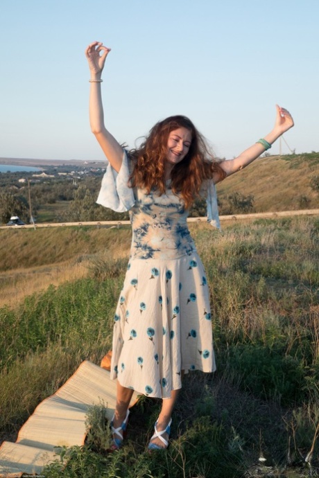 Russian ginger Helen Volga strips naked outdoors and plays with her sexy bush