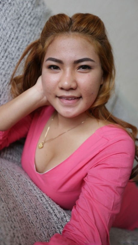 Pretty Asian babe Pat B shows her hairy pussy after a sexy striptease