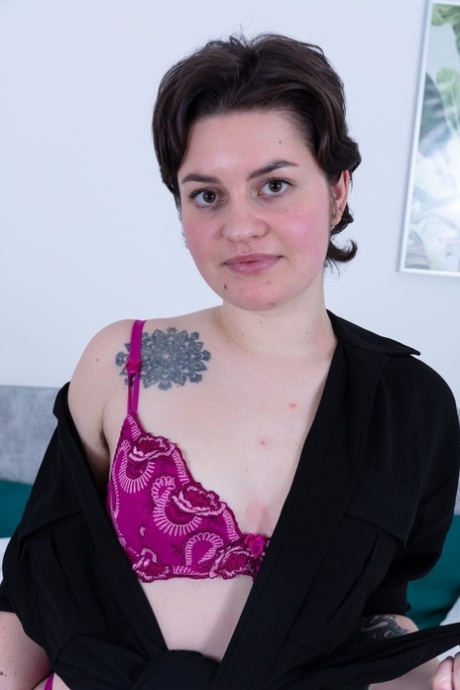 Sexy brunette Maja Aguilar undresses and plays with her super furry pussy