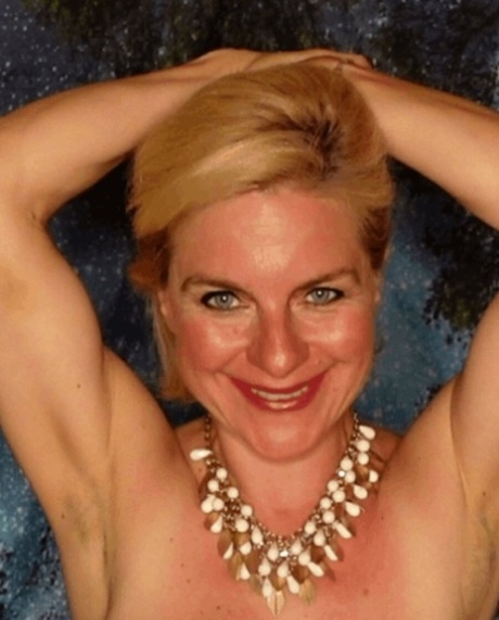 Mature blonde amateur fondles her huge juggs and poses in a lacy bra