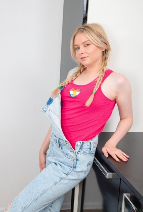 European teen Sweety Hilary shows off her small tits and hairy twat in a solo