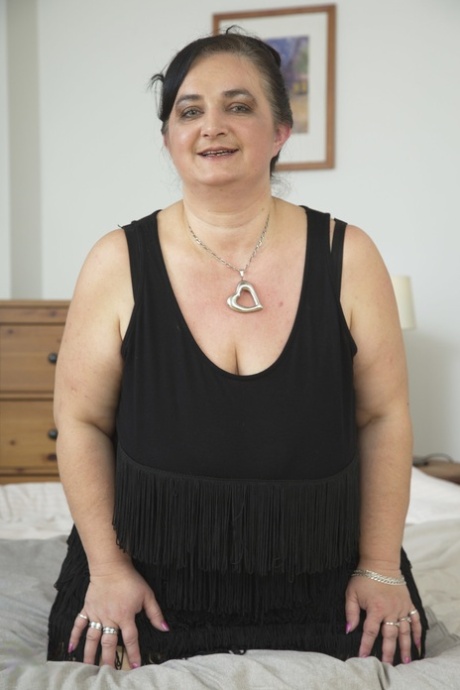 Fat BBW Stefanka C shows her massive melons and masturbates on a bed