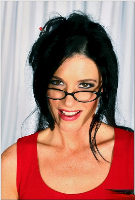 Dark-haired secretary India Summer exposes her amazing figure and rides a dick